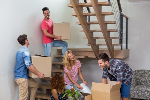 Removal team loading household items for a Crooklog move