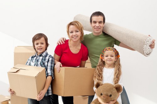 Local movers handling equipment during a Crooklog business relocation