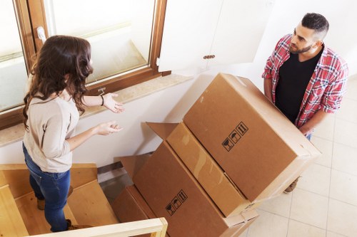 A professional van moving team following safety procedures